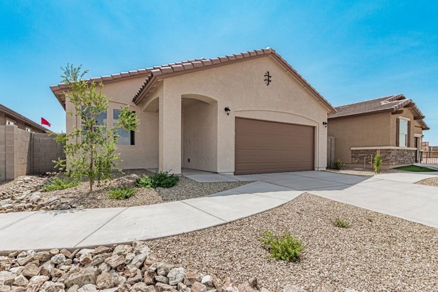 Front exterior of a home in the Maple at North Copper Canyon community, located in Surprise, AZ (Image 16). Front exterior of a home in the Maple at North Copper Canyon community, located in Surprise, AZ (Image 16).