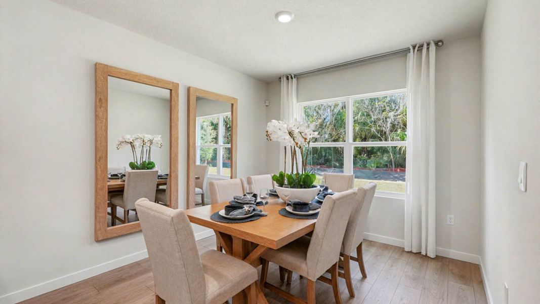 Furnished interior in a model home at Indian River Preserve in Mims (Image 7).