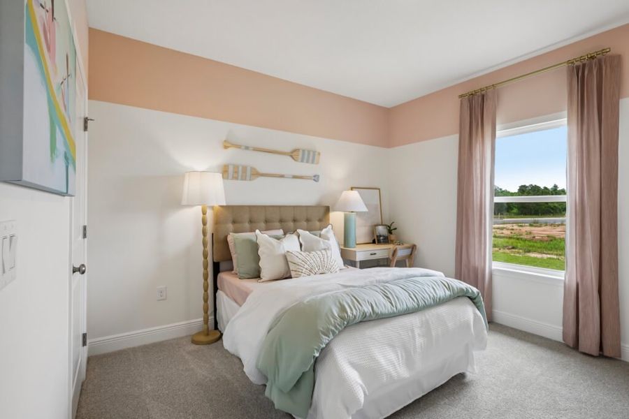 Furnished interior in a model home at Mahogany At Jubilee in Pace (Image 32).