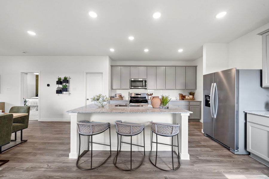 A kitchen with a table and chairs. A kitchen with a table and chairs.