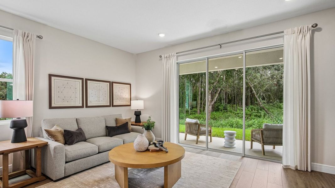 Furnished interior in a model home at Sanctuary at Citrus Park Townhomes in Tampa (Image 9).
