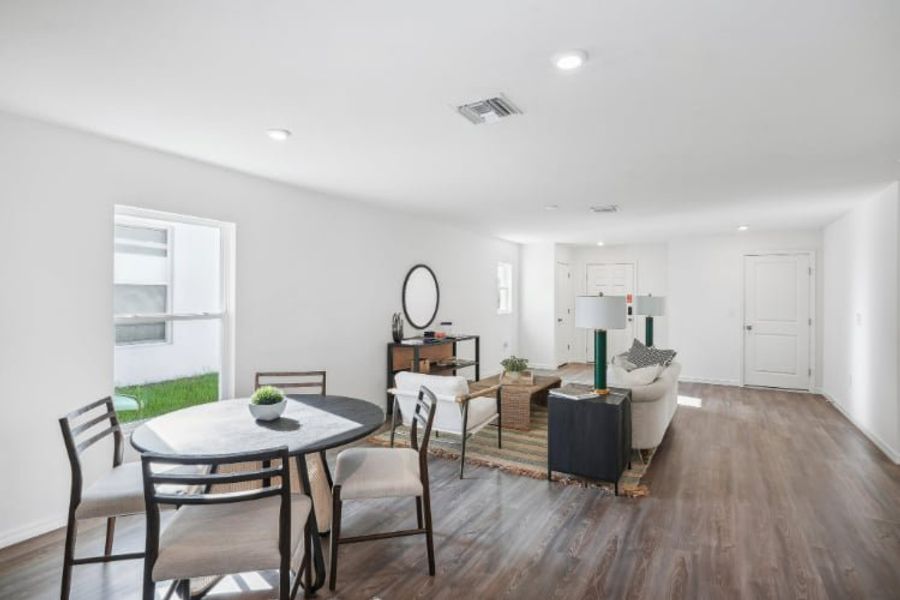 A room with a table and chairs.