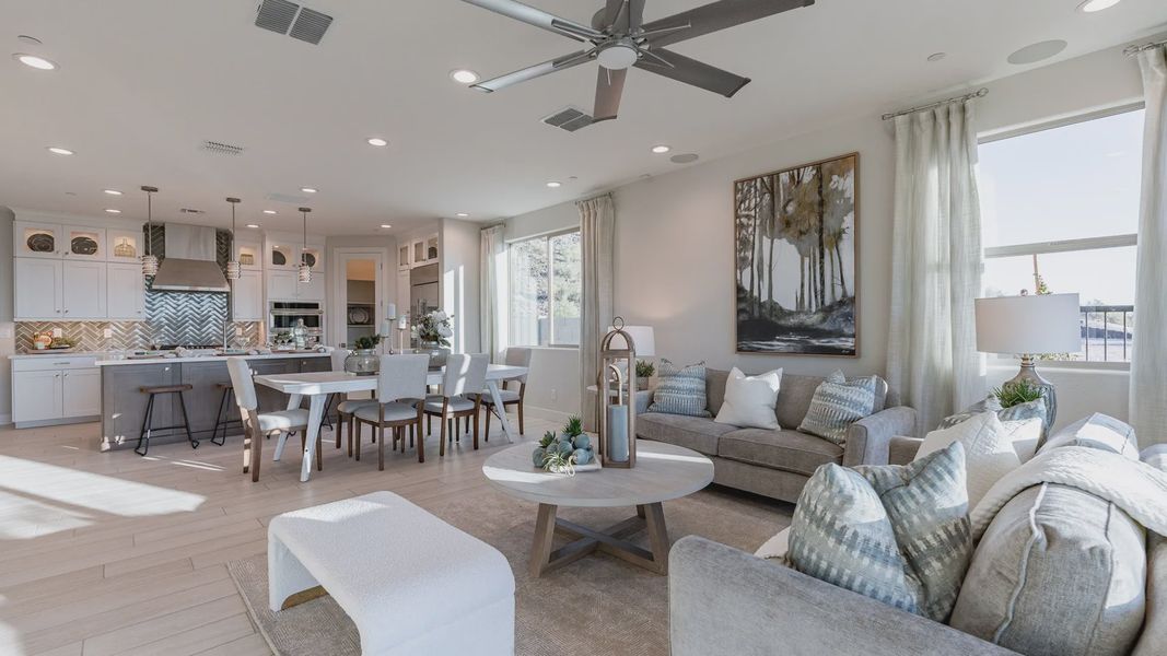 Sophisticated open-plan space with top-tier finishes and expansive windows in Mystic Villas community.