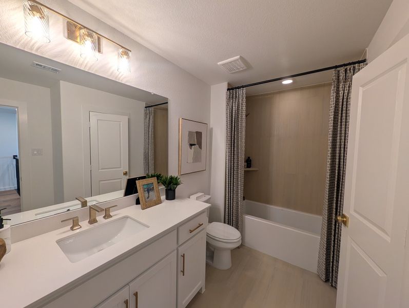 Furnished interior in a model home at Ramble 60s in Celina (Image 20).