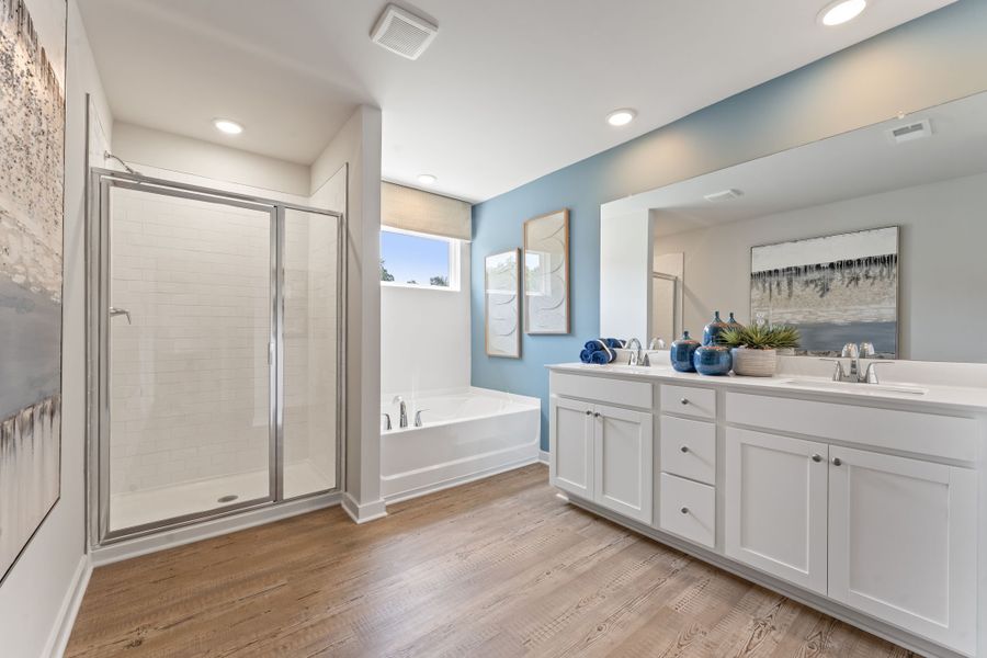 A bathroom with a tub and sink.