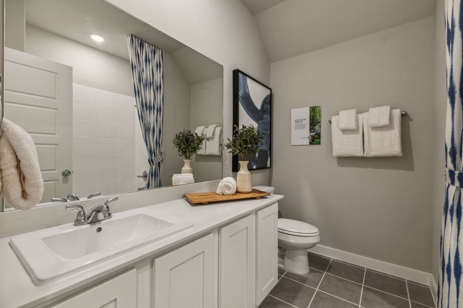 REPRESENTATIVE PHOTO – Bathroom in a Tesoro at Chisholm Trail Ranch new home in Crowley TX by Trophy Signature Homes