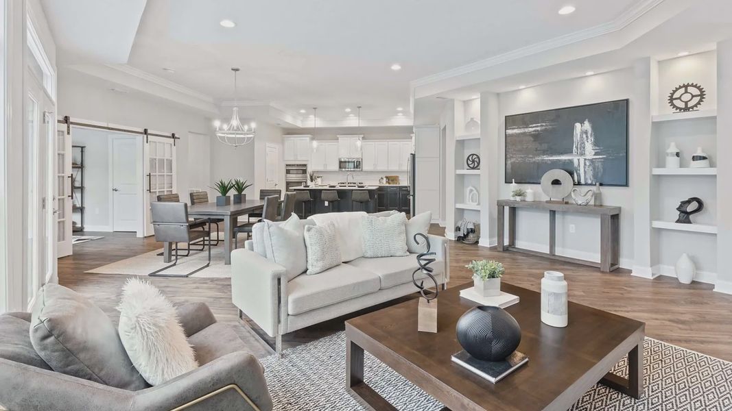 Furnished interior in a model home at The Courtyards at Redbud Lane in Holly Springs (Image 8).