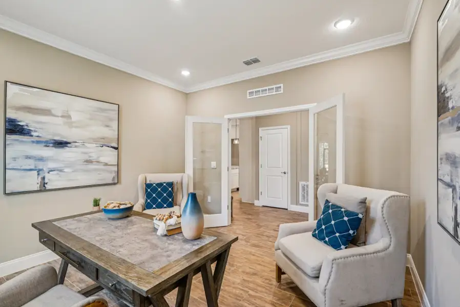 Furnished interior in a model home at Malabar Springs Executive in Palm Bay (Image 6).