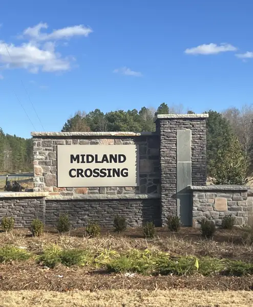 Entrance to the Midland Crossing community in Midland, NC, featuring signage and landscaping (Image 1).