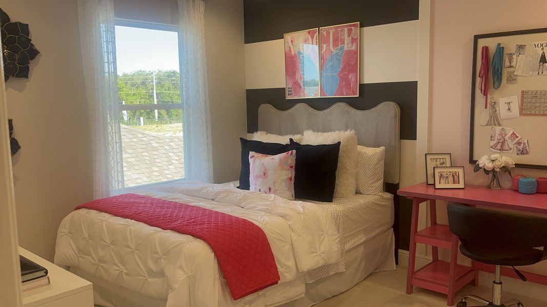 A chic bedroom with a bold striped wall, plush bedding, a pop of pink accents, and vibrant decor elements for a stylish vibe. A chic bedroom with a bold striped wall, plush bedding, a pop of pink accents, and vibrant decor elements for a stylish vibe.