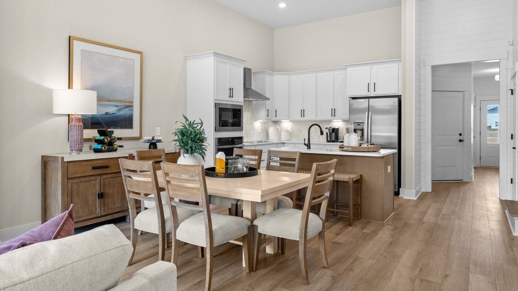 Dining area in the Summit home plan with open-concept design and natural light.