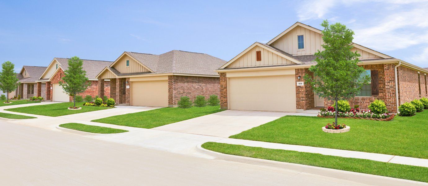 Front exterior of a home in the Mobberly Farms: Watermill Collection community, located in Pilot Point, TX (Image 1).