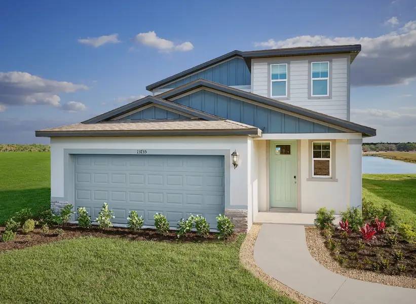 Front exterior of a home in the Two Rivers - Premier Series community, located in Zephyrhills, FL (Image 2). Front exterior of a home in the Two Rivers - Premier Series community, located in Zephyrhills, FL (Image 2).