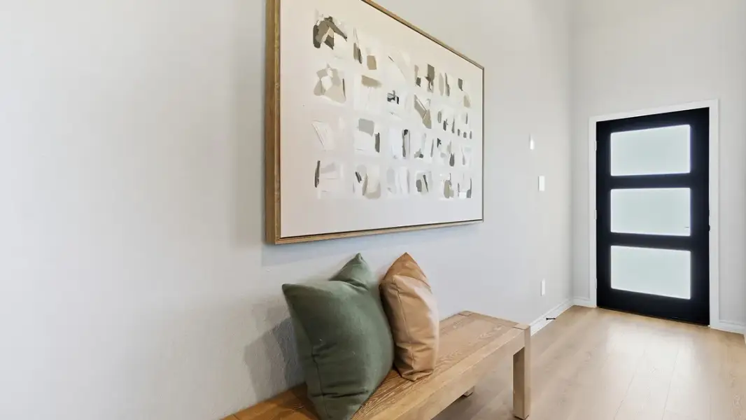 Furnished interior in a model home at The Woodlands at Medina Hills in Mico (Image 16).