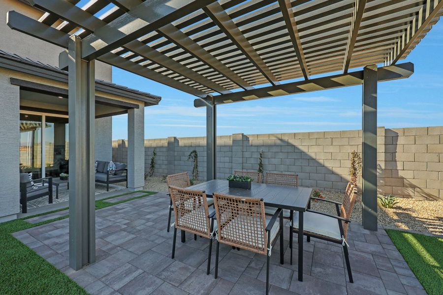 A patio with a table and chairs. A patio with a table and chairs.