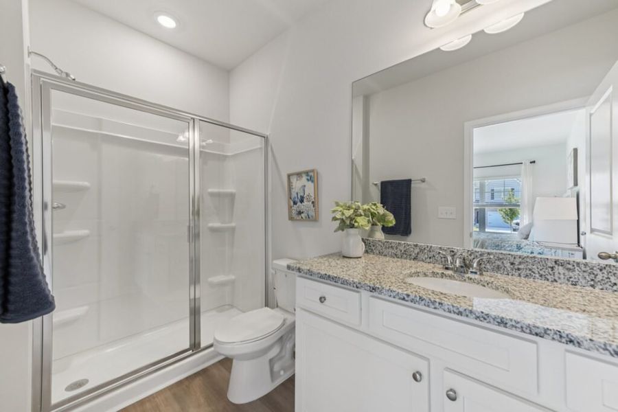 Furnished interior in a model home at The Hills at Cedar Creek in Winder (Image 61).