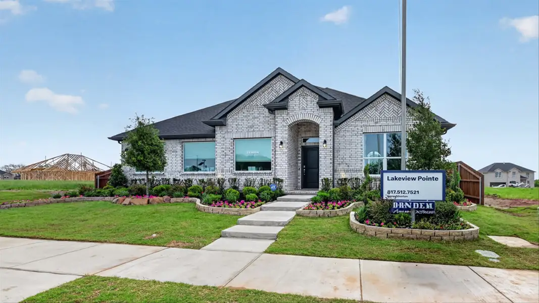 Front exterior of a home in the Lakeview Pointe community, located in Grand Prairie, TX (Image 2).
