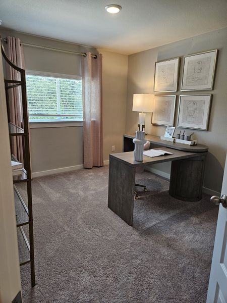 A cozy home office with plush carpet, modern desk, elegant lamp, and stylish artwork on the wall, creating a serene workspace. A cozy home office with plush carpet, modern desk, elegant lamp, and stylish artwork on the wall, creating a serene workspace.