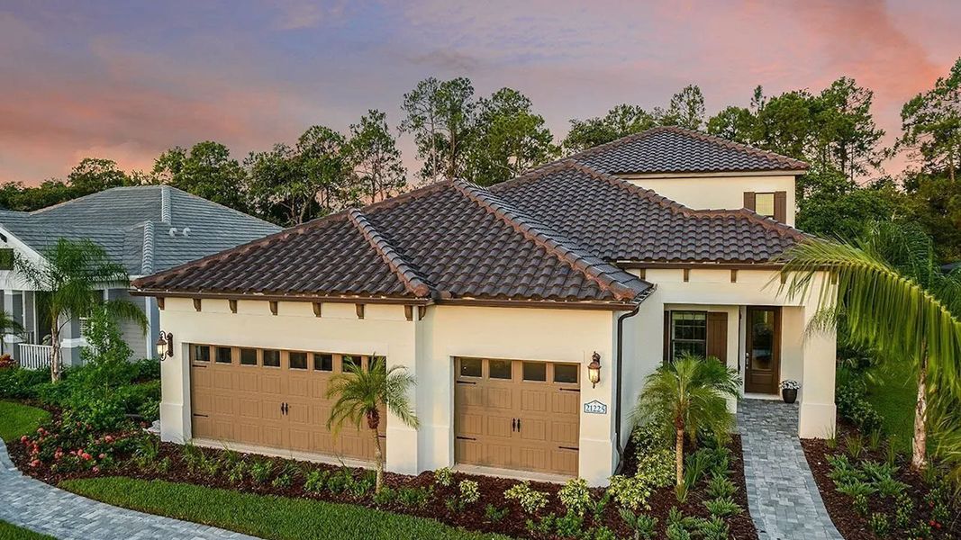 Front exterior of a home in the Boca Royale Golf & Country Club Real Estate and Homes for Sale in Englewood, FL - Neal Communities community, located in Englewood, FL (Image 4).