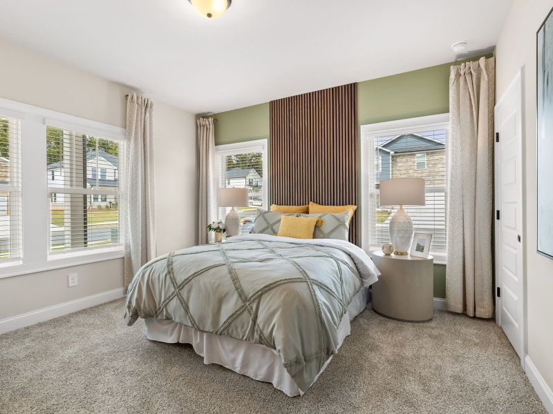 One secondary bedroom is located on the bottom level, perfect for a guest room.