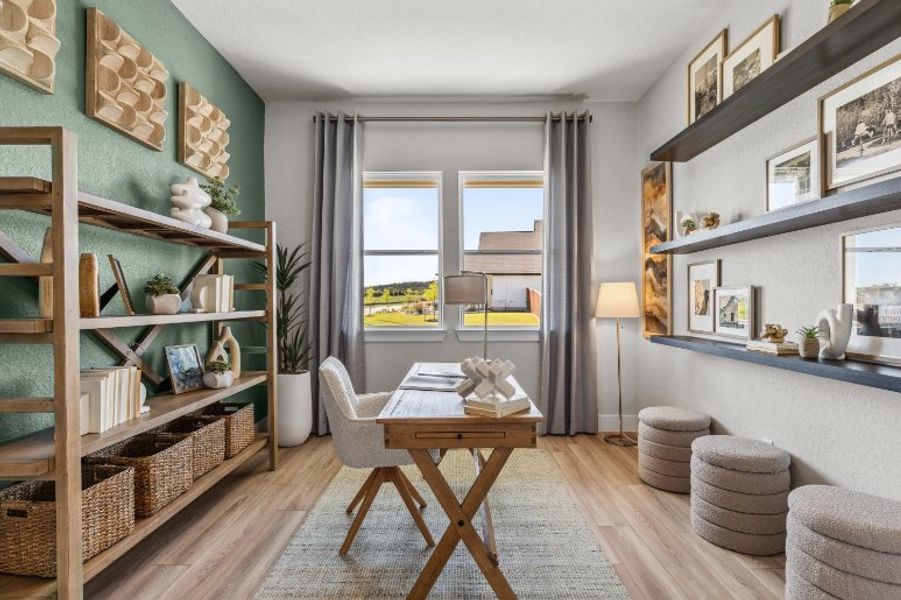 A room with a table and chairs.