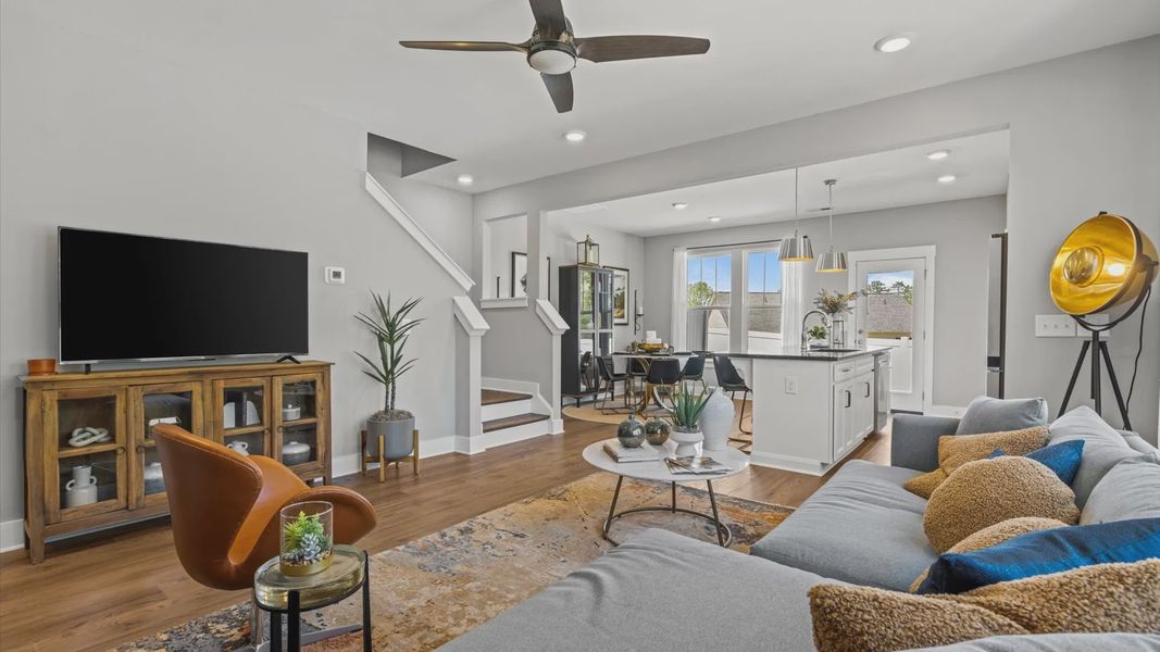 Downtown Greenville, SC two story townhome with modern family room with large windows & hardwood flooring at Hickory Heights