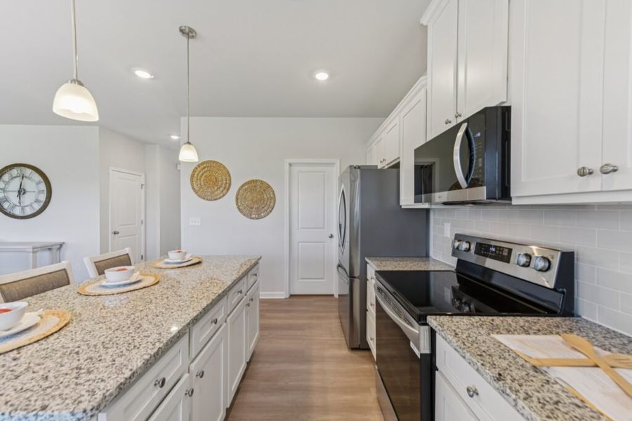 Furnished interior in a model home at The Hills at Cedar Creek in Winder (Image 54).