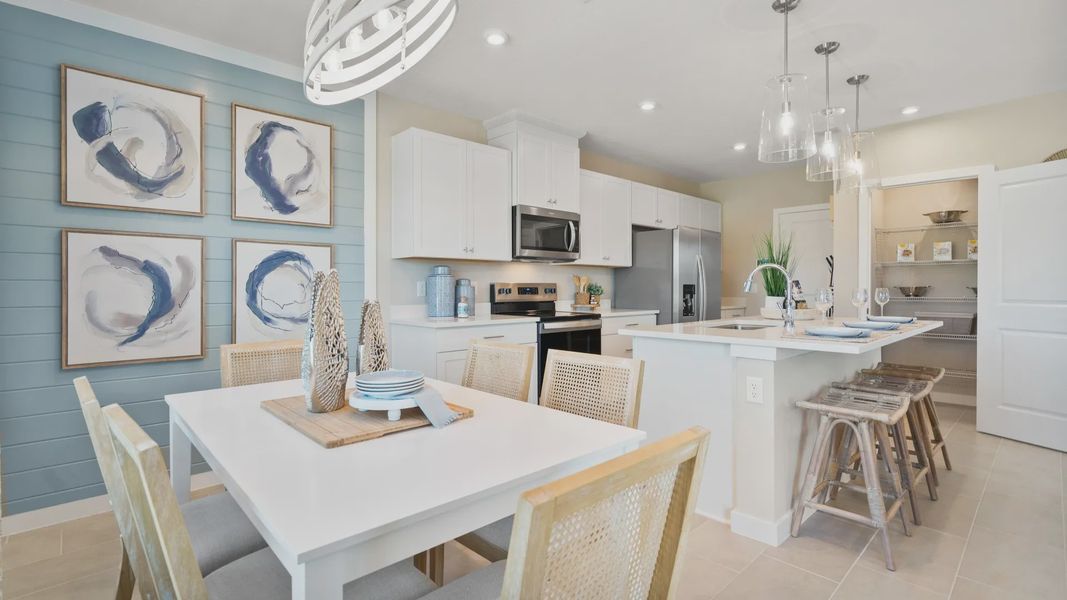 The kitchen and dining area at DRB Homes is perfect for cooking, dining, and spending time with loved ones. The kitchen and dining area at DRB Homes is perfect for cooking, dining, and spending time with loved ones.