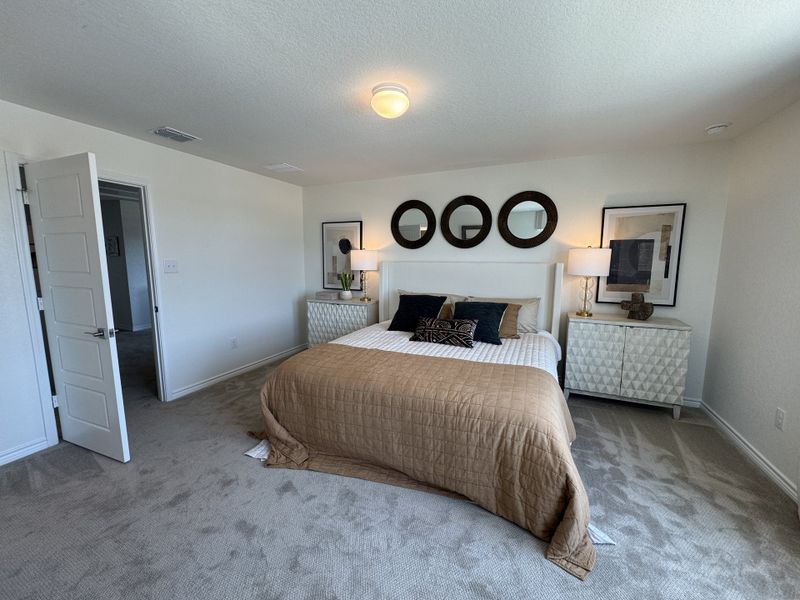 A cozy bedroom with neutral tones, geometric mirrors, stylish lamps, and contemporary art accents. A cozy bedroom with neutral tones, geometric mirrors, stylish lamps, and contemporary art accents.