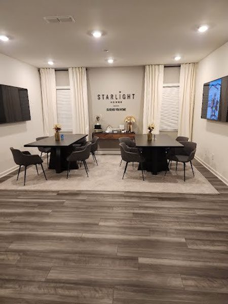 A modern meeting room with sleek tables, plush chairs, and stylish decor.