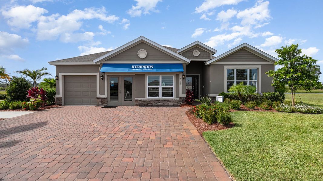 Front exterior of a home in the Crystal Bay Estates community, located in Grant-Valkaria, FL (Image 4).