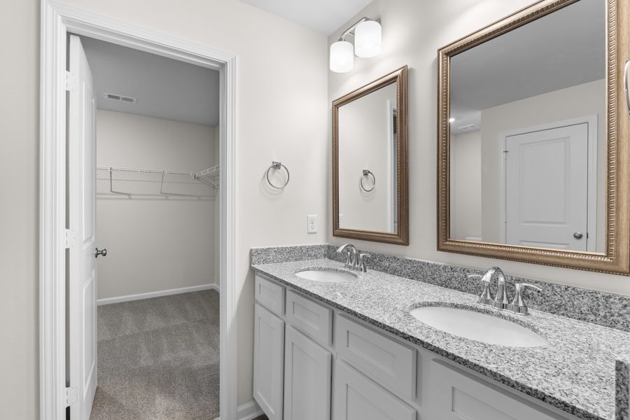 Furnished interior in a model home at Harmon Terrace in Hopkins (Image 28).