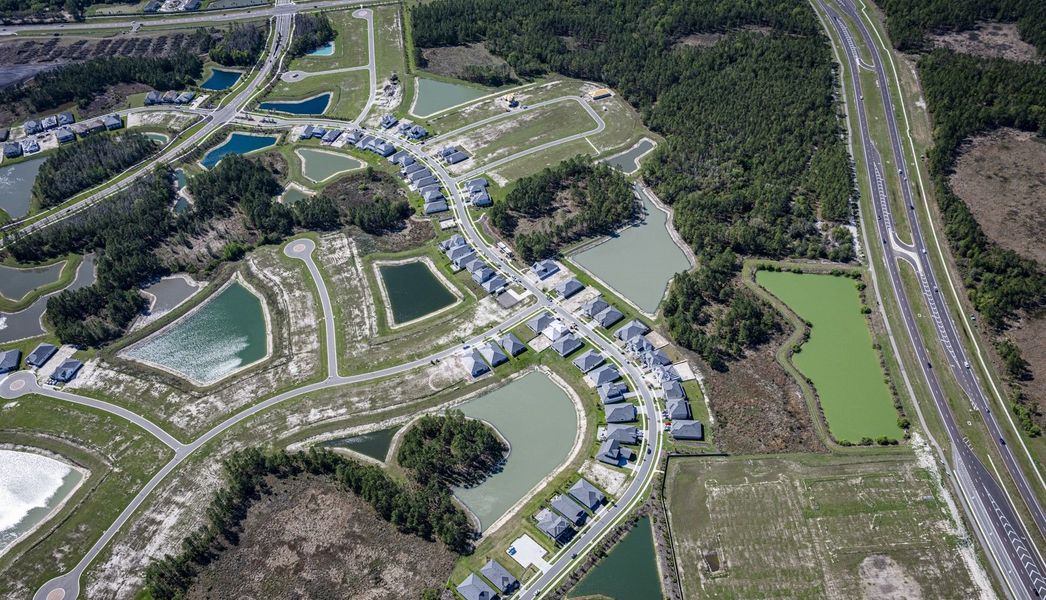 Aerial view of the Tamarack at Two Rivers community in Zephyrhills, FL, showing layout and nearby surroundings (Image 13).