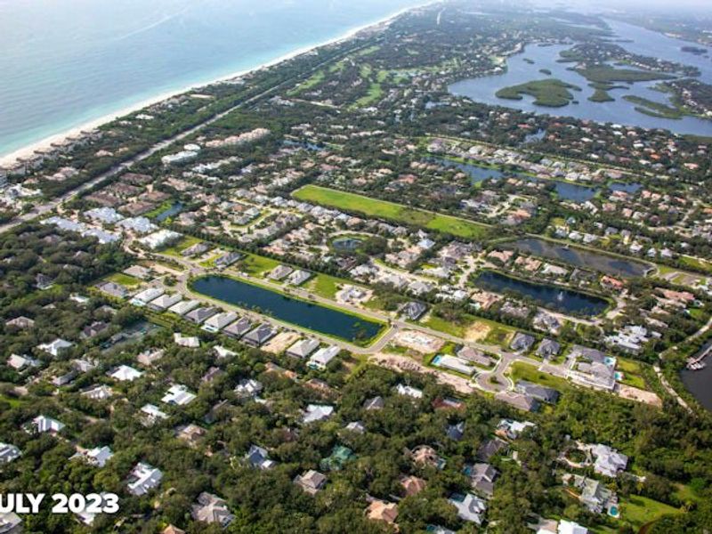 Aerial view of the The Strand community in Vero Beach, FL, showing layout and nearby surroundings (Image 15).