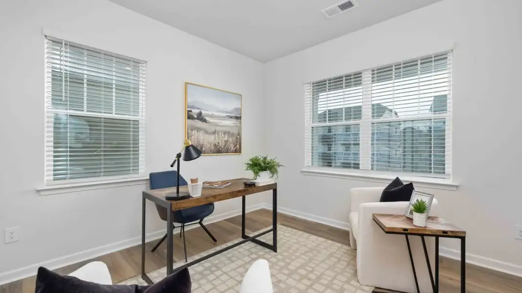 Furnished interior in a model home at Sweetwater Village in Rockwell (Image 3).