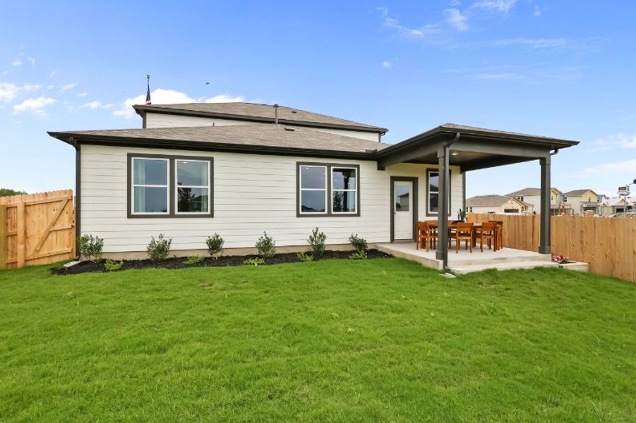 A house with a fence and grass. A house with a fence and grass.