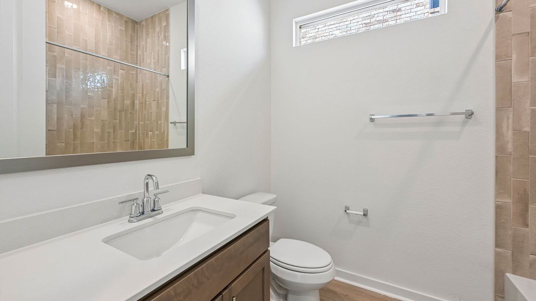 Furnished interior in a model home at The Enclave at Bar W Ranch in Leander (Image 12).