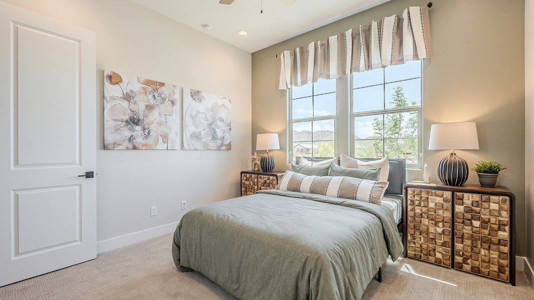 This Hacienda at Estrella bedroom boasts panoramic windows, exquisite decor, and serene mountain views.