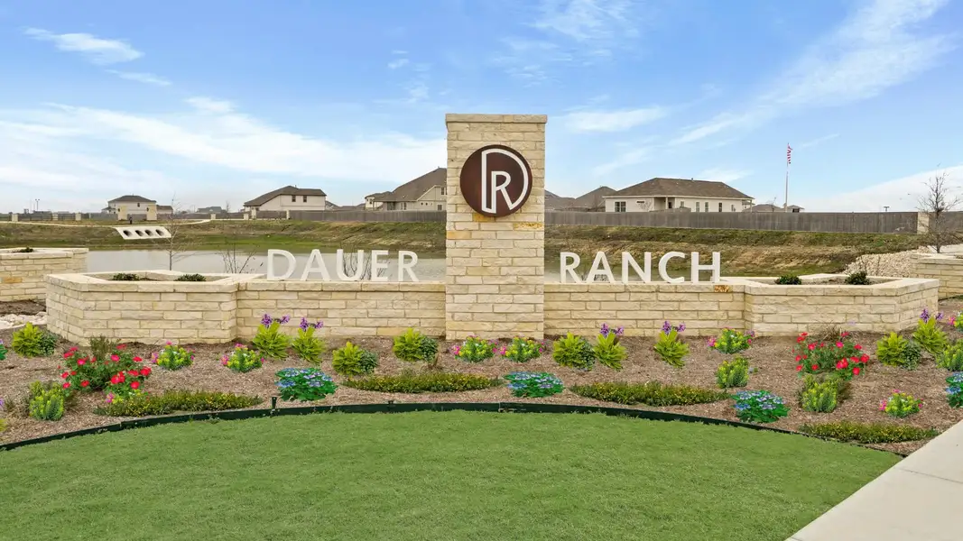 Entrance to the Dauer Ranch community in New Braunfels, TX, featuring signage and landscaping (Image 1). Entrance to the Dauer Ranch community in New Braunfels, TX, featuring signage and landscaping (Image 1).
