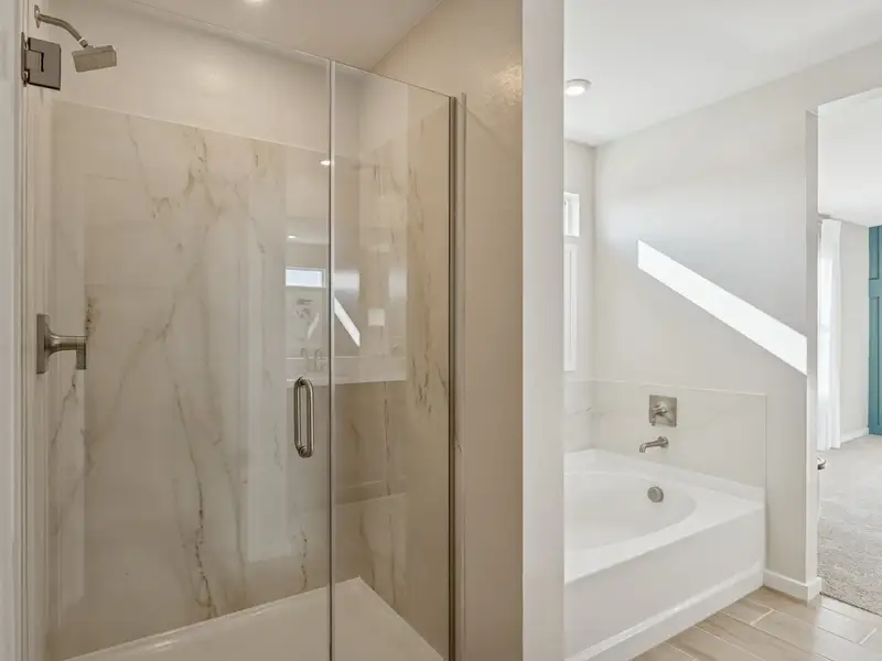 A bathroom with a glass shower.