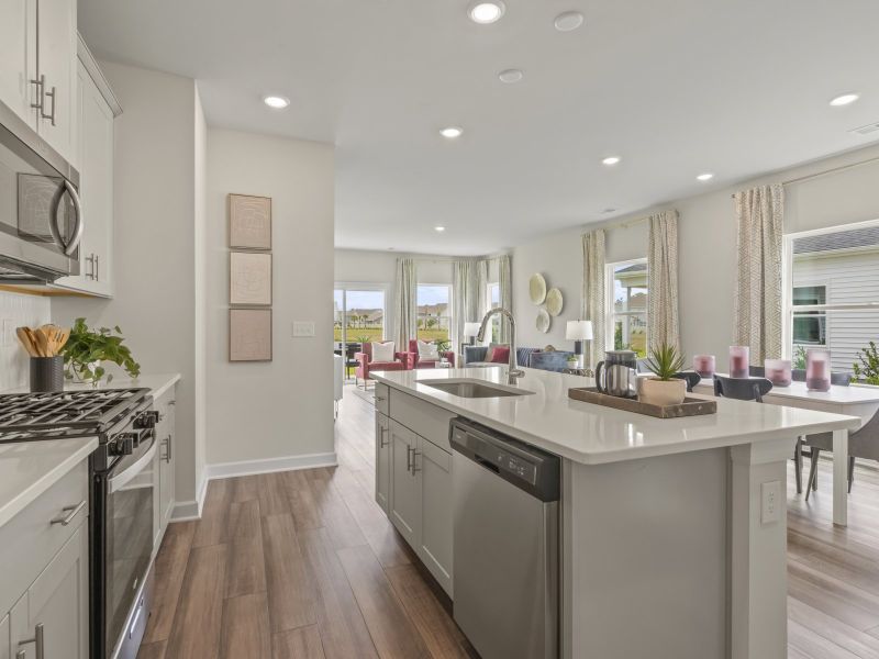 The well-appointed kitchen features a large island to make meal prep a breeze.