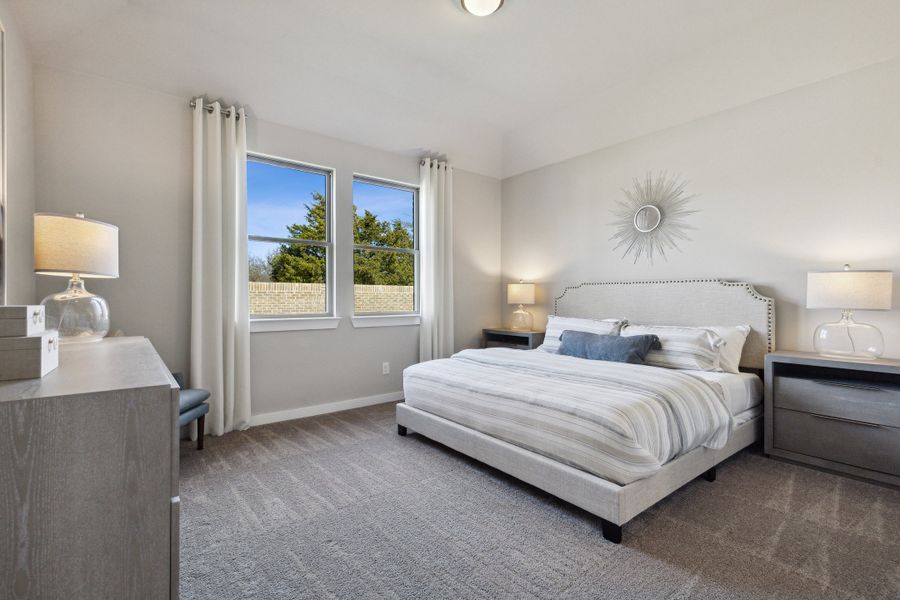 Primary Suite in an Oak Model Home by Trophy Signature Homes