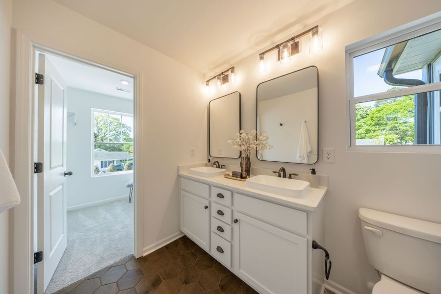 Furnished interior in a model home at College Park in Louisburg (Image 18). Furnished interior in a model home at College Park in Louisburg (Image 18).