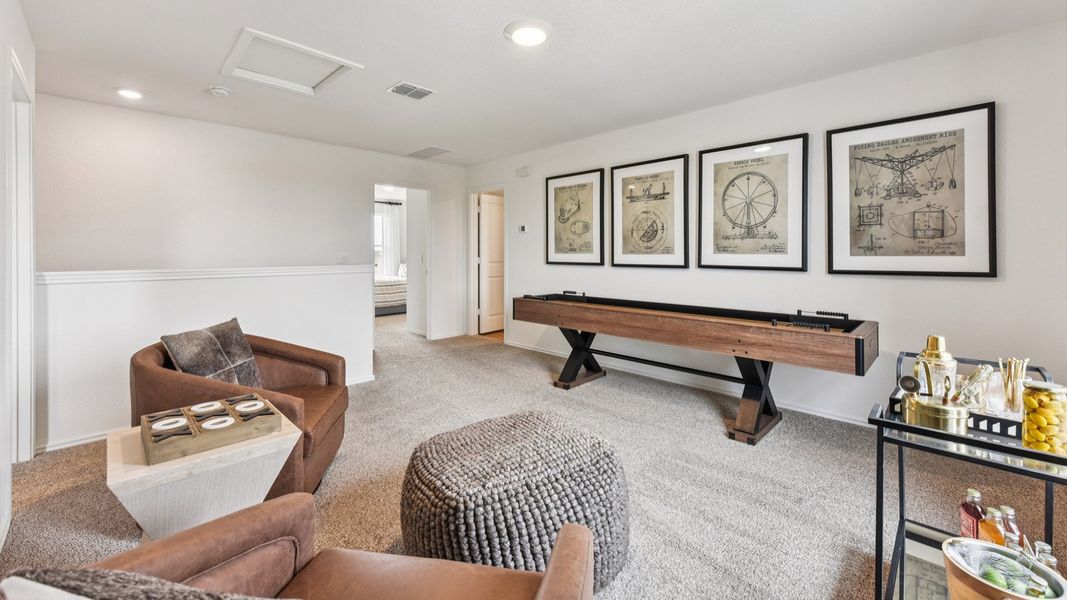 Furnished interior in a model home at Palomino in Manor (Image 38).