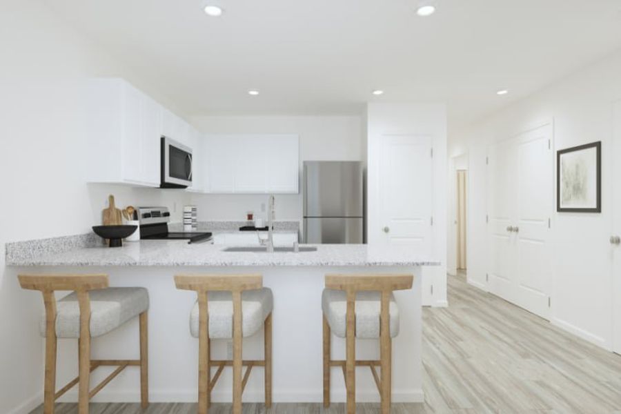 A kitchen with white cabinets. A kitchen with white cabinets.