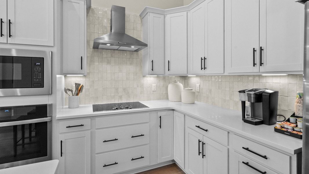Stylish kitchen in the Summit home plan with quality finishes and functional design.