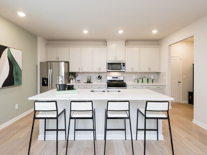 Furnished interior in a model home at Marshburn Landing - Bungalow Series in Wendell (Image 2).