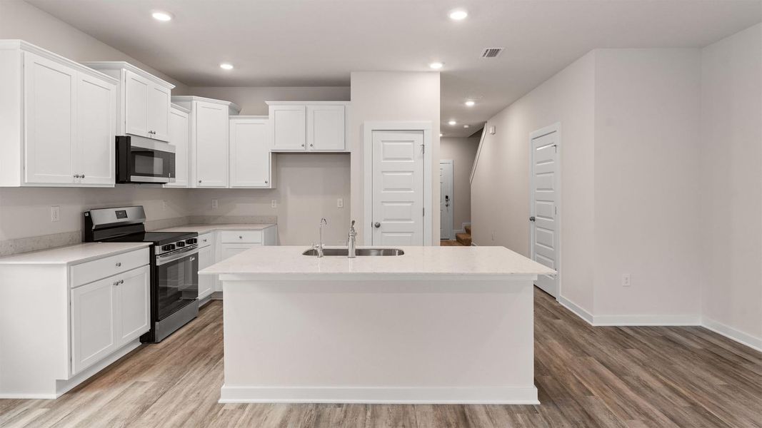 Furnished interior in a model home at Genoa Landing Townhomes in Freeport (Image 6).