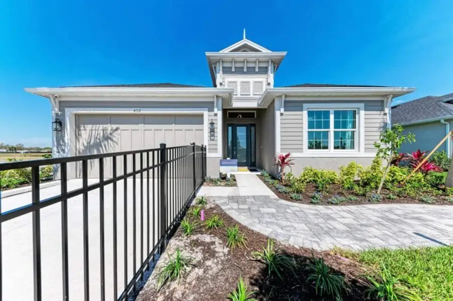 Front exterior of a home in the The Willows community, located in Parrish, FL (Image 4). Front exterior of a home in the The Willows community, located in Parrish, FL (Image 4).