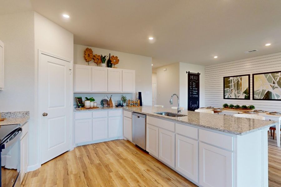 A kitchen with white cabinets. A kitchen with white cabinets.